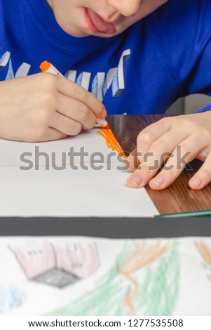 Boy drawing at table