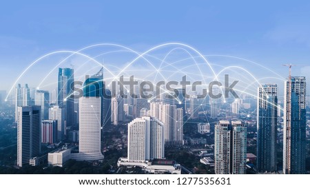 Aerial view of high buildings with network connection at morning time in Jakarta city