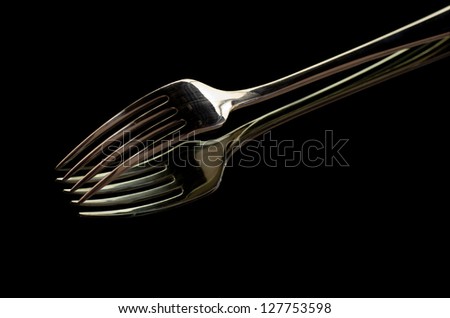 picture of a silver fork in a mirror