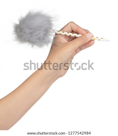 Hand holding Fluffy Ball Pen isolated on white background 