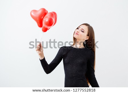 beautiful girl with red balloons on white background