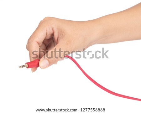 Hand holding Plug RCA Audio jack cable isolated on white background