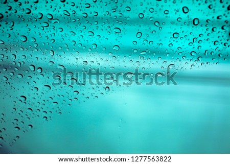 Water drops of rain on  glass background 