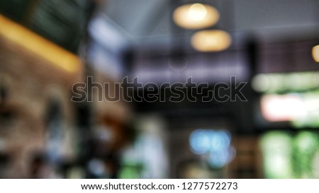 Abstract blur coffee shop background. Blurred background : Coffee shop blur background with bokeh light with vintage filter.