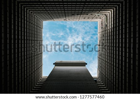 Bottom View of abstract Tunnel corridor stack building with symmetry layer and sky background