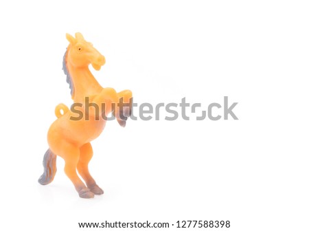 Toy horse made of plastic isolated on white background