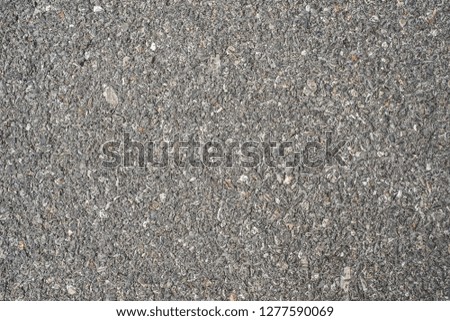 Close-up,abstract cement mixed with black stone texture.Sand stone pebbles texture background for interior, exterior and industrial construction concept design.