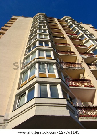 The multistorey modern house on the blue sky background