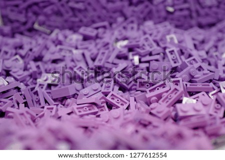 Many pieces of purple toys block 