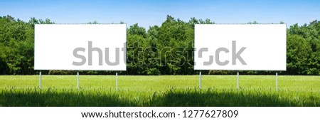 Double blank advertising billboard immersed in a rural scene - image with copy space