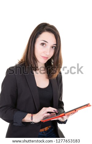 cheerful attractive young businesswoman standing using tablet computer over white background