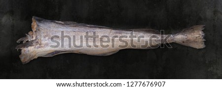Cod stockfish on black rough background