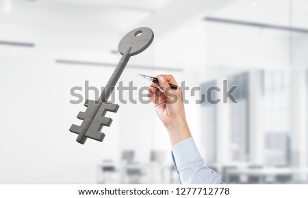 Cropped image of businessman in suit touch with pen stone key symbol. Mixed media