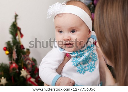 Happy mother and baby. Family, child and parenthood concept - happy smiling young mother with little baby at home