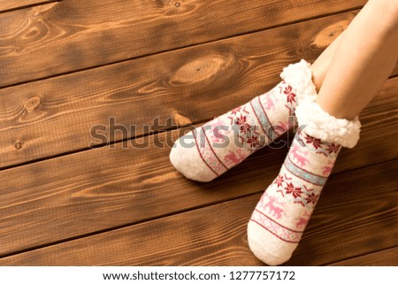 Funny warm socks on the little girl's feet.