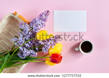 Spring background, tulips and a cup of coffee with a place for text, greeting card with the eighth of March