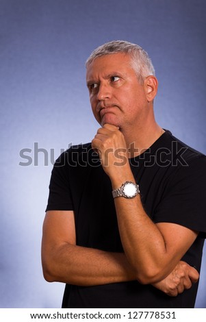 Handsome middle age man in a studio portrait.