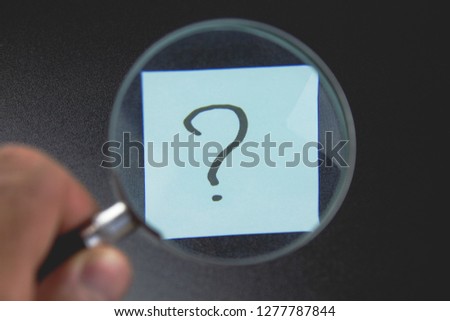 

Magnifying glass and question mark