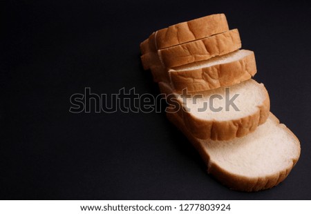 Soft bread with a black background.