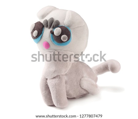 Kid's modelling clay cat isolated on white background