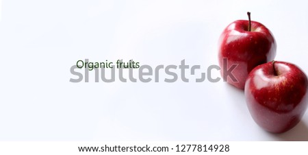 It is a close-up picture of a juicy red apple on a white background
