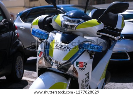 Lisbon municipal police motorbike parked on city street