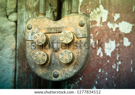 Old rural farm of peasants. On the barn hangs a lock with a code set on the numbers. Picture taken in Ukraine, Kiev region. Black and white image. Color image