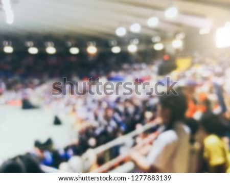 Blurred background of football, volleyball sport league cup championship international competition match from indoor arena with young fans crowd cheer up, support and watch from stand for win victory