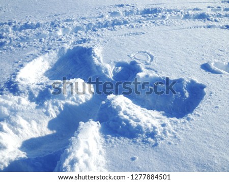 Big picture of the snow angel on clean snow