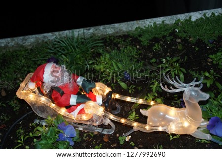 Santa Claus in his sleigh.
