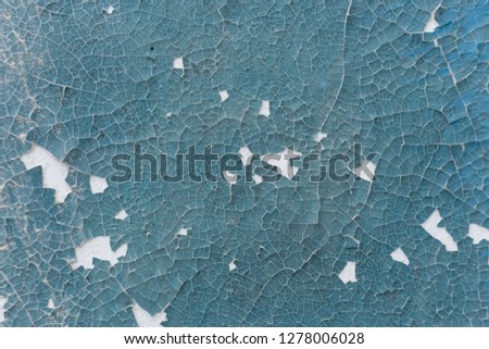 Peeling blue paint on wall seamless texture. Pattern of rustic blue grunge material