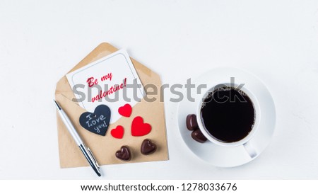Flat Lay - Valentines day mockup. Love card. Coffee cup, chocolate candy and paper card with envelope on white table. Top view, place for space, banner image