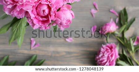   Pink peony flowers on wooden background.  Mothers day. Flat lay, top view. 
