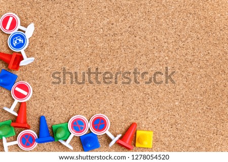 Traffic signs of various colors on the cork board, text entry area