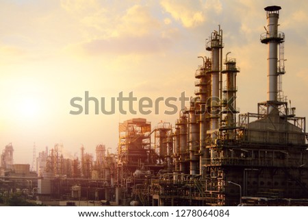 Industrial furnace cracked hydrocarbon in petrochemical business on sunset sky background, Manufacturing of petroleum industrial plant Royalty-Free Stock Photo #1278064084