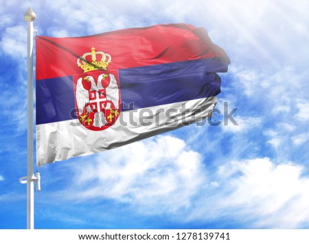 National flag of Serbia on a flagpole