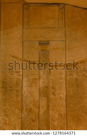 Egyptian ancient hieroglyphs on a stone wall