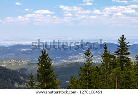 View of downtown Denver, Colorado city skyline seen from the front range mountains