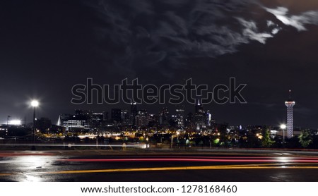 Dark night view of the downtown Denver Colorado skyline with colorful night lights