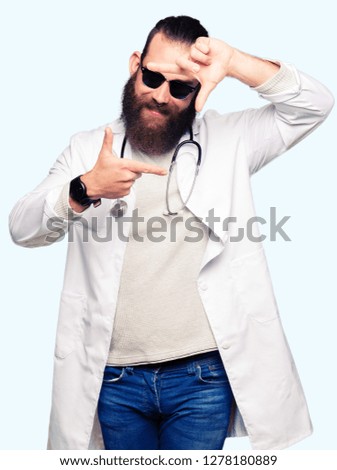 Young blond doctor man with beard wearing sunglasses smiling making frame with hands and fingers with happy face. Creativity and photography concept.