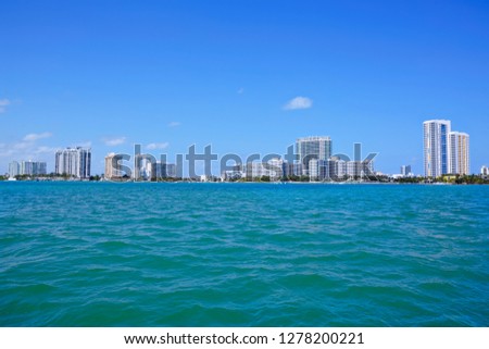 Miami, Florida, USA downtown skyline. Building, ocean beach and blue sky. Beautiful city of United States of America.
