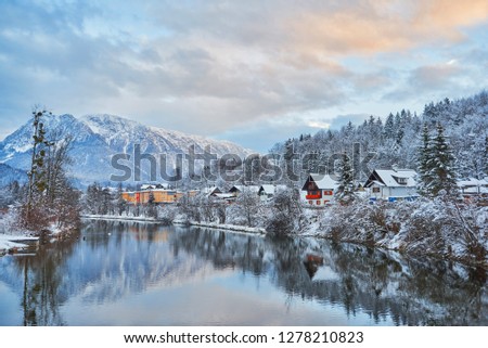 Scenic picture-postcard landscape with lake Traun, forest and mountains at evening in Austrian Alps. Beautiful view in winter. Austria, Bad Goisern