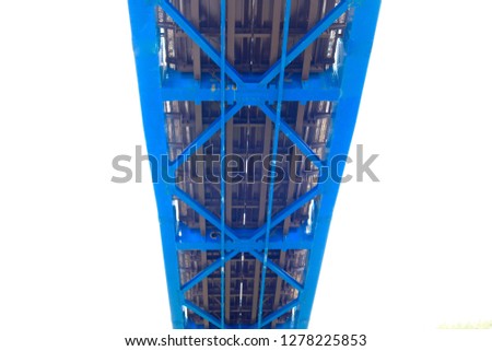 Underside Of Blue Bridge Showing Structure Against White Background Revealing Geometric Design