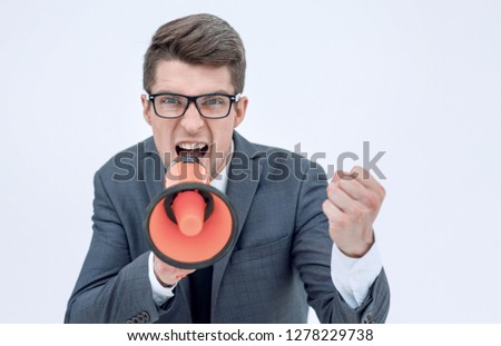 close up. angry businessman with a megaphone