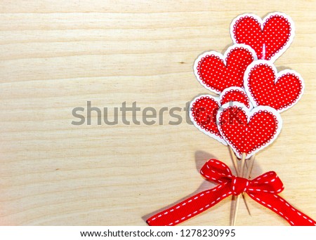Red paper hearts on wooden sticks for Valetine's day Royalty-Free Stock Photo #1278230995