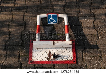Disabled person parking space protector close up