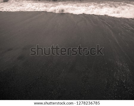 Dark beach and the waves