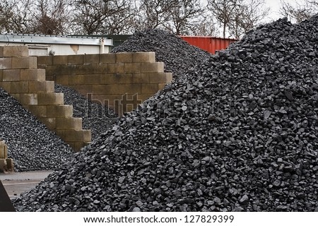 Coal yard with supply in heaps for domestic use