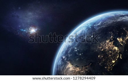 Nightly planet Earth before the dawn. Galaxy on the horizon. Civilization. Elements of this image furnished by NASA