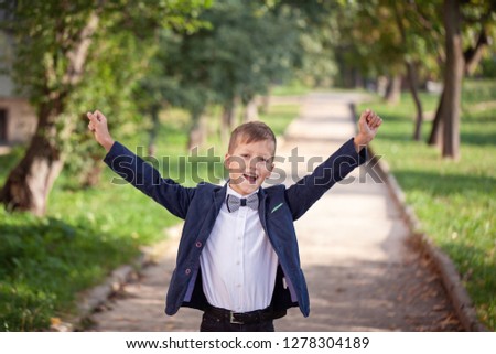 Portrait of fashion child on nature background. Funny little boy. 7 years old